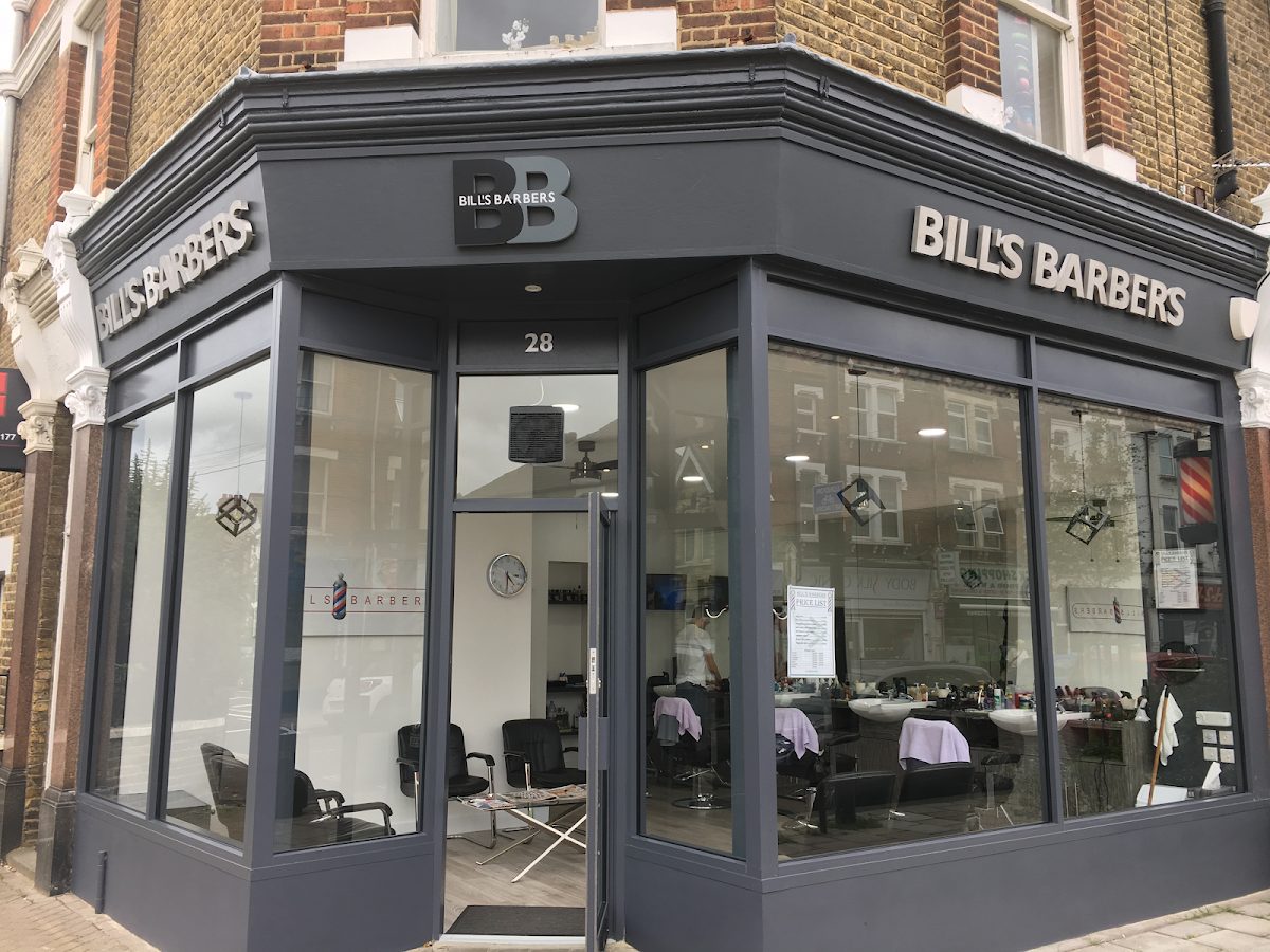 The grey and silver shopfront of Bill's Barbers at 28 Staplehurst Road